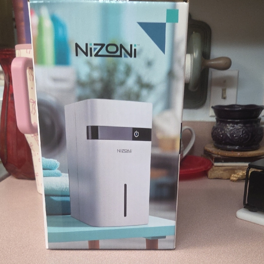 Compact 1.2-Liter White Dehumidifier - Picture 4 of 4